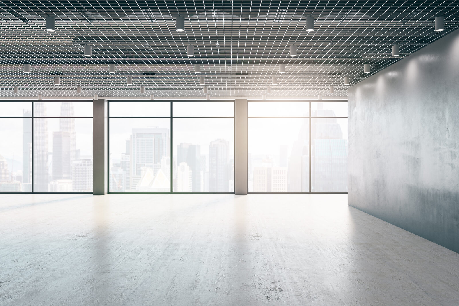 A large, empty, unfurnished office floor
